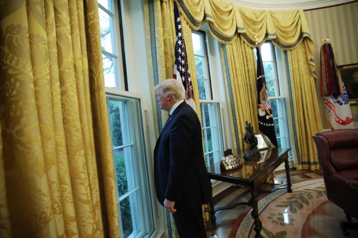 U.S. President Donald Trump looks out a window of the Oval Office following an interview with Reuters at the White House in Washington, U.S., April 27, 2017. REUTERS/Carlos Barria